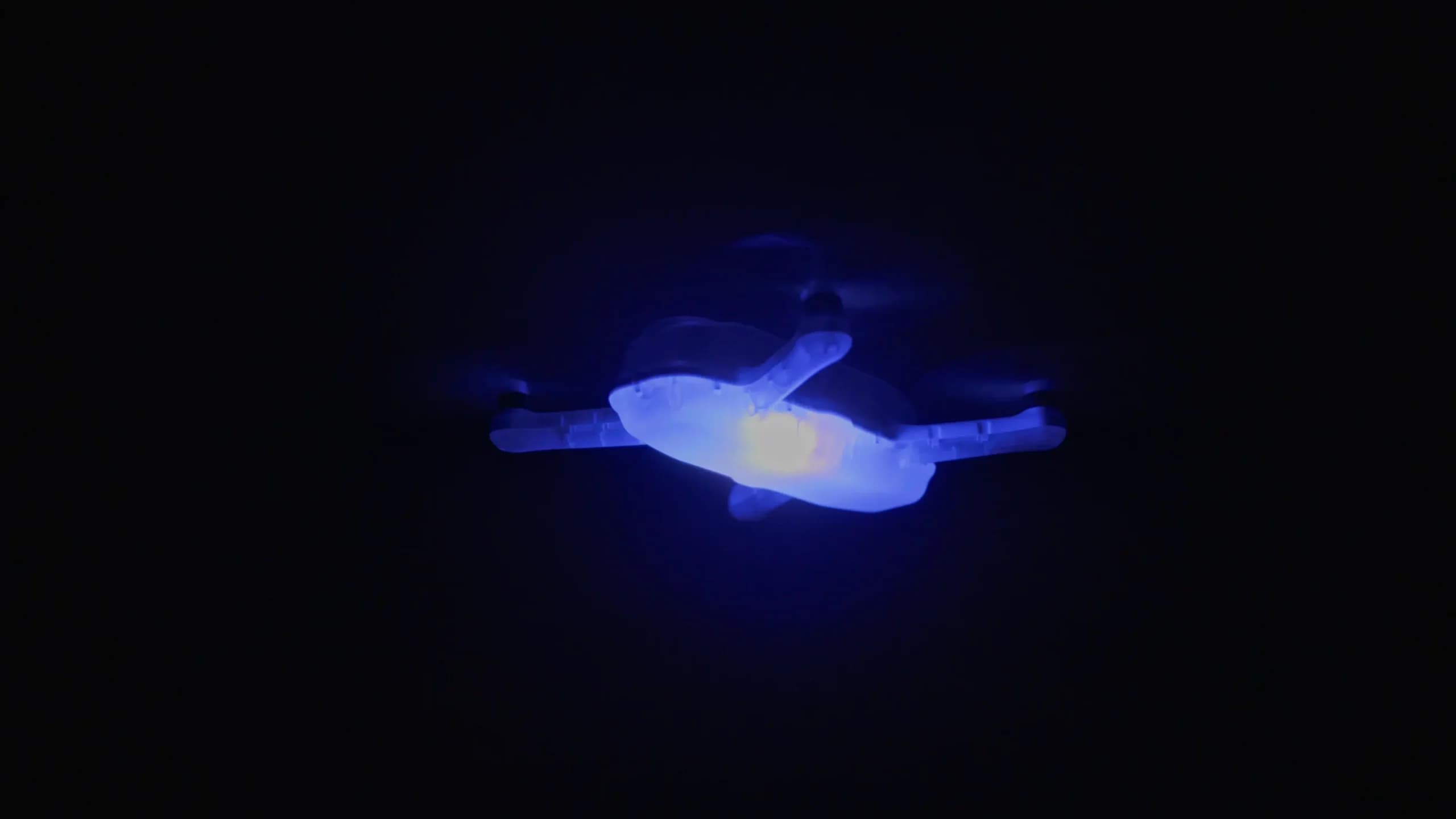 Professional drone with LED lighting flying at night, optimized for drone light shows and aerial performances.